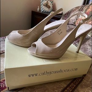 Sling back cream colored heels. excellent condition. Only minor scuff